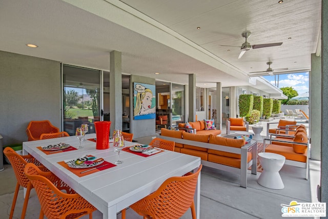 view of patio with an outdoor living space and ceiling fan