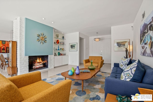 living room featuring a fireplace and light tile patterned floors