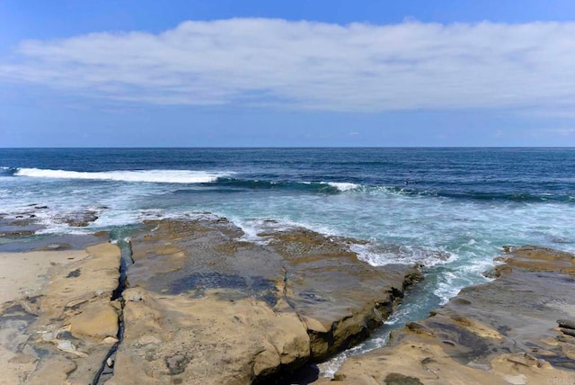 view of water feature with a beach view