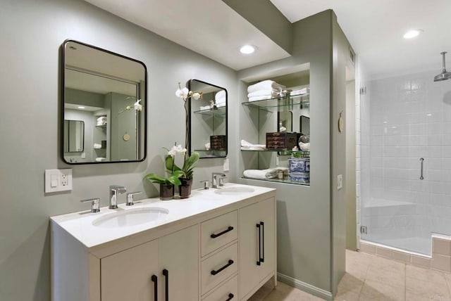 bathroom featuring walk in shower, vanity, and tile patterned flooring