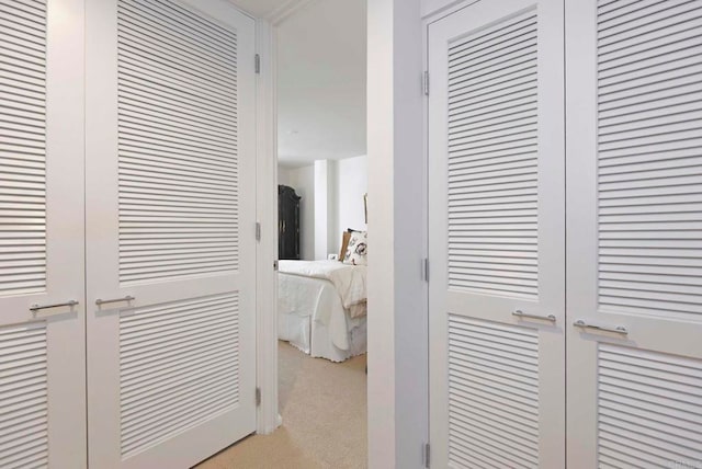 101 Coast Blvd Unit 1C, La Jolla, CA 92037 - hallway featuring light carpet
