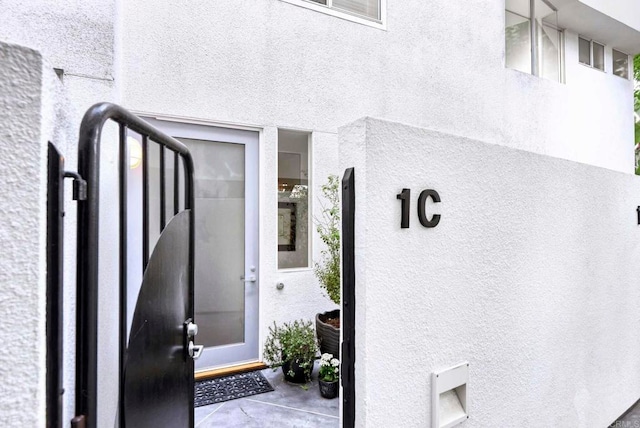 101 Coast Blvd Unit 1C, La Jolla, CA 92037 - view of exterior entry featuring stucco siding