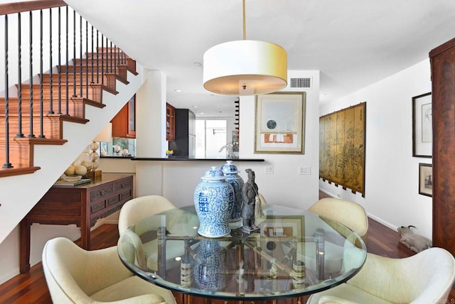 101 Coast Blvd Unit 1C, La Jolla, CA 92037 - dining room with wood finished floors, stairway, and baseboards