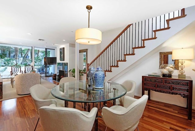 101 Coast Blvd Unit 1C, La Jolla, CA 92037 - dining room featuring wood finished floors, stairs, recessed lighting, and floor to ceiling windows