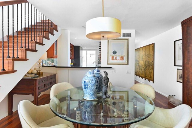 101 Coast Blvd Unit 1C, La Jolla, CA 92037 - dining area with wood finished floors and stairs