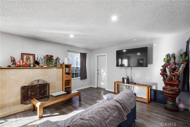 living room with a textured ceiling and dark wood-type flooring