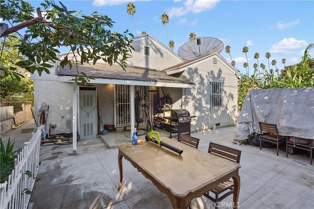 view of patio with a grill