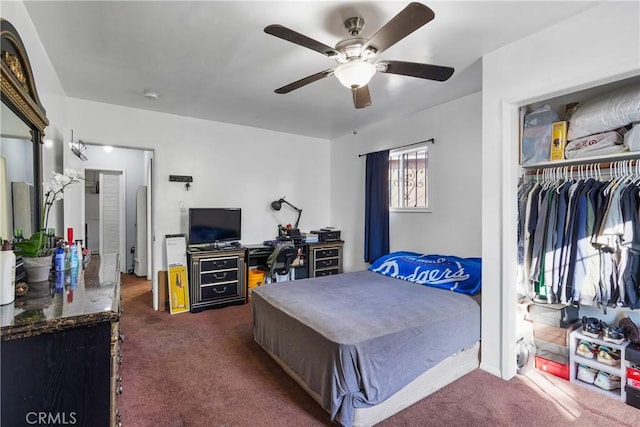 carpeted bedroom with a closet and ceiling fan