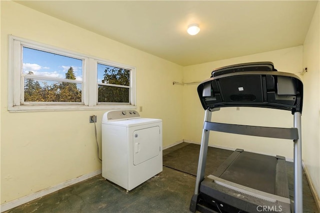 clothes washing area featuring washer / dryer