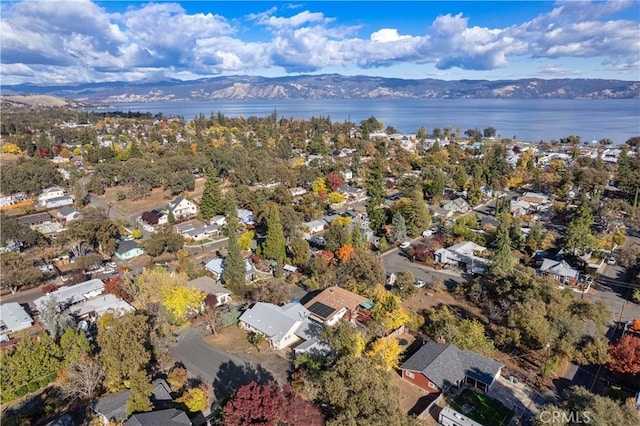 bird's eye view with a water and mountain view