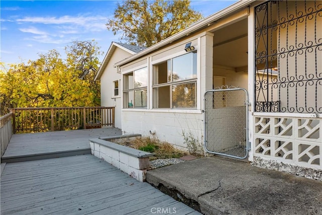 view of side of property with a wooden deck