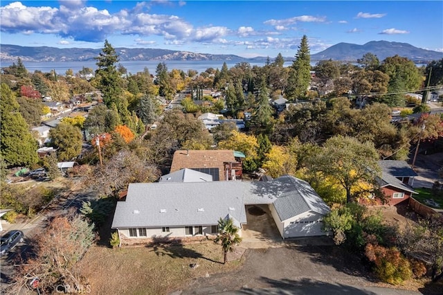 birds eye view of property with a mountain view