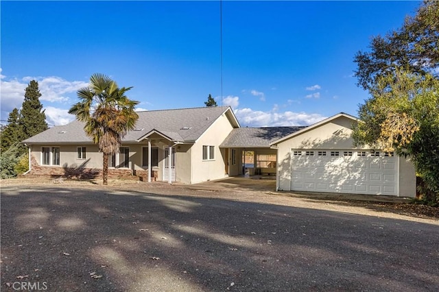 ranch-style home featuring a garage