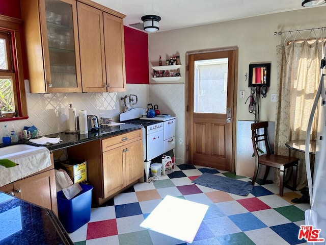 kitchen featuring tasteful backsplash and sink