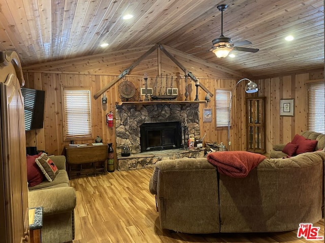 living room featuring light hardwood / wood-style flooring, ceiling fan, lofted ceiling, and wood ceiling