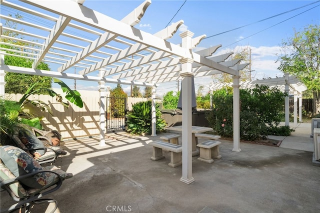 view of patio / terrace with a pergola and a hot tub