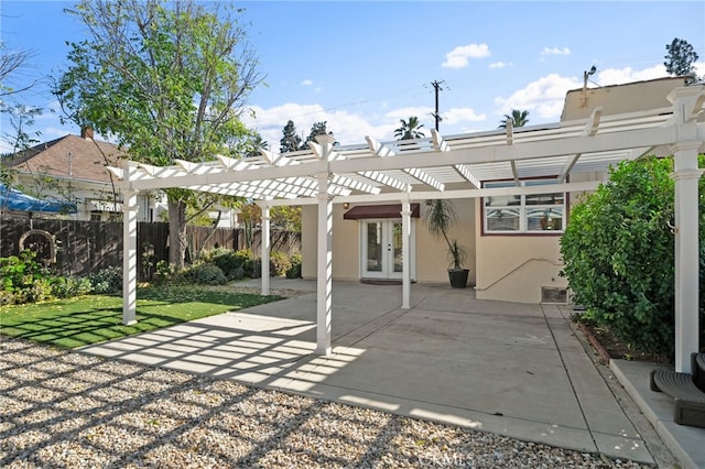 view of patio / terrace featuring french doors and a pergola