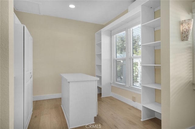 spacious closet featuring light hardwood / wood-style floors