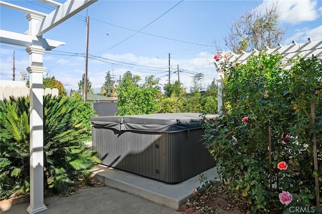 view of patio / terrace featuring a hot tub