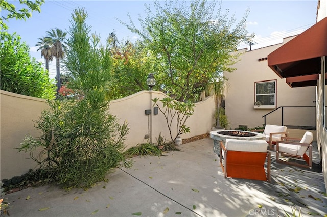 view of patio / terrace featuring a fire pit