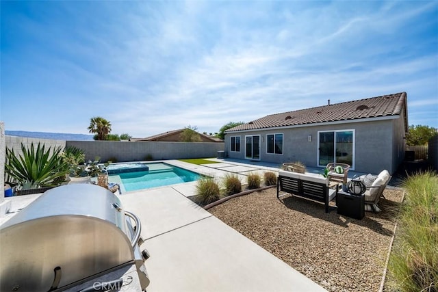 view of swimming pool featuring a grill, a patio, and an outdoor hangout area