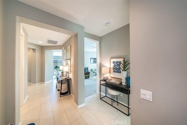 hallway featuring light tile patterned floors