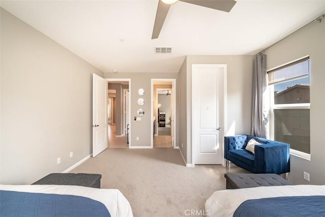 bedroom with ceiling fan and light carpet