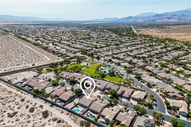 birds eye view of property featuring a mountain view