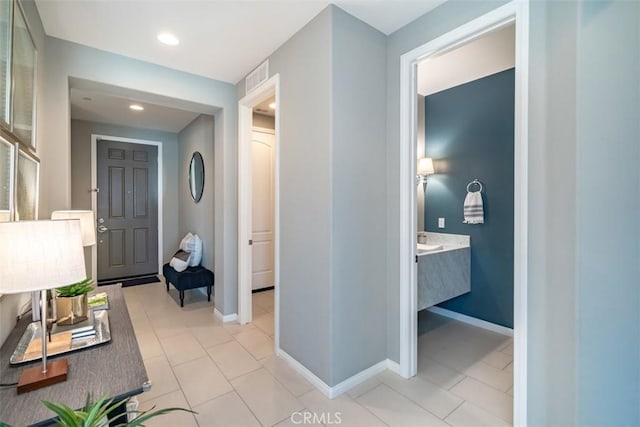 hallway with light tile patterned floors