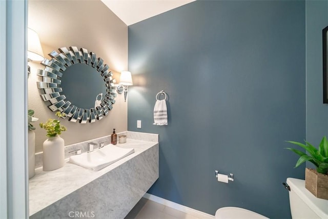 bathroom featuring sink and toilet