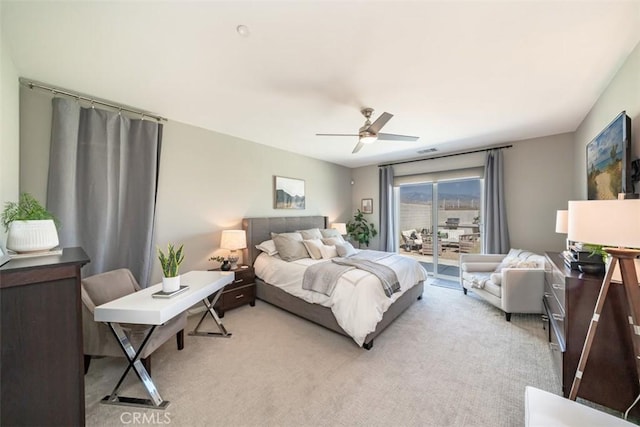 bedroom with access to exterior, ceiling fan, and light carpet