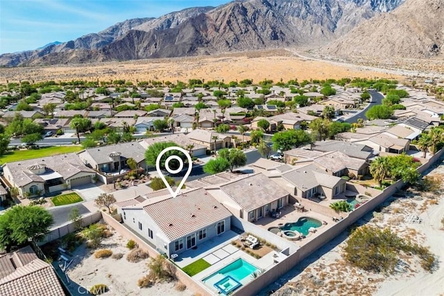 birds eye view of property featuring a mountain view