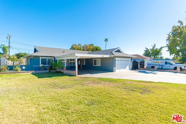 ranch-style house featuring a garage and a front lawn