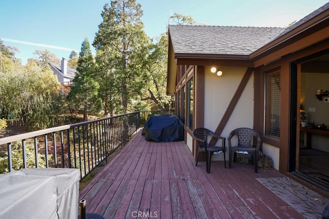 wooden terrace with area for grilling