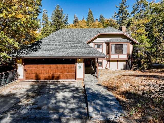 view of front of house featuring a carport and a garage