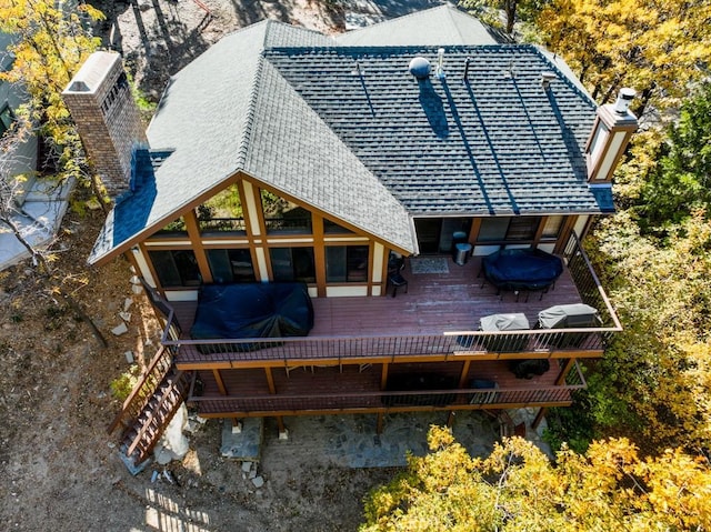 back of property with a wooden deck