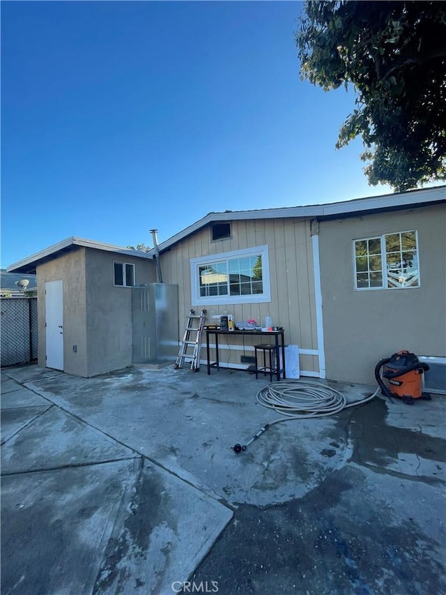 back of property featuring a patio area