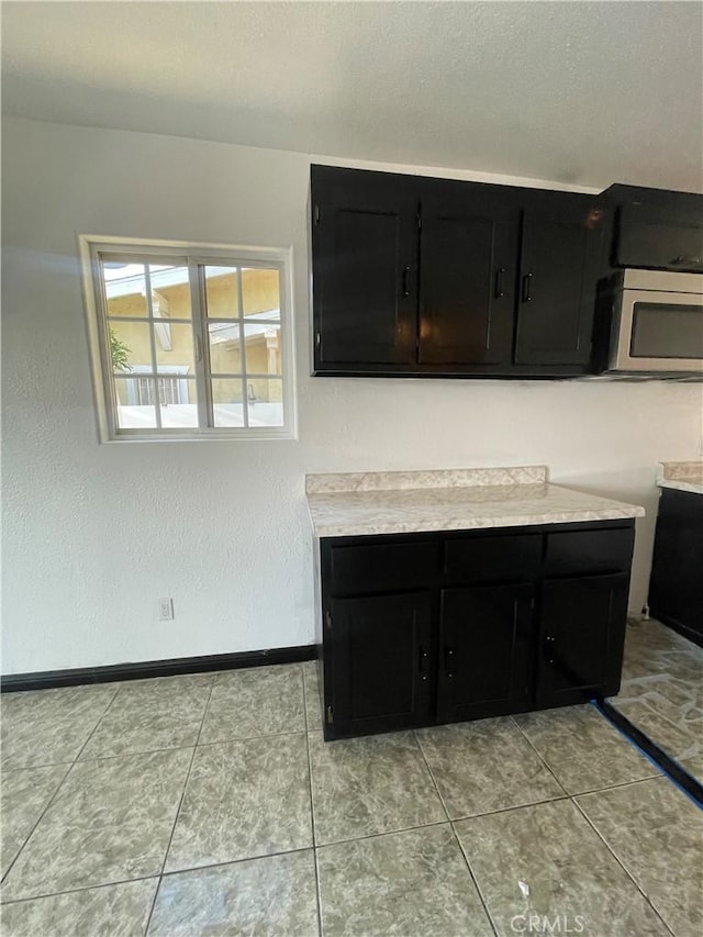 kitchen with light tile patterned floors