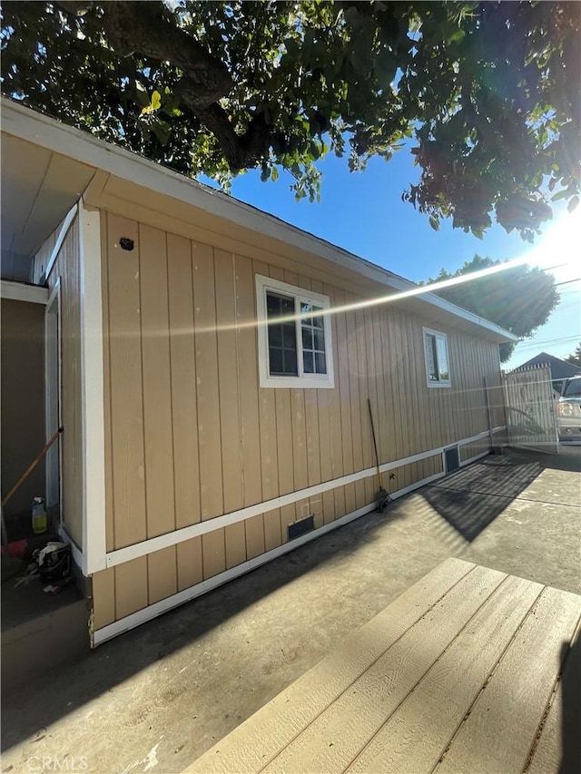 view of side of property featuring a patio area