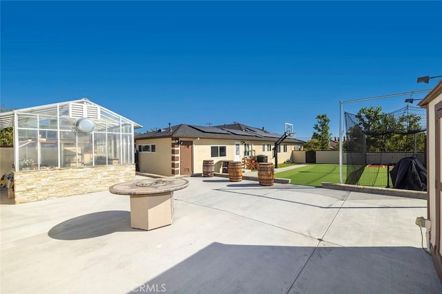 view of patio with a fire pit