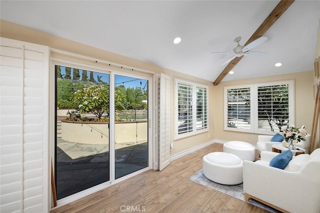 interior space featuring lofted ceiling with beams and ceiling fan