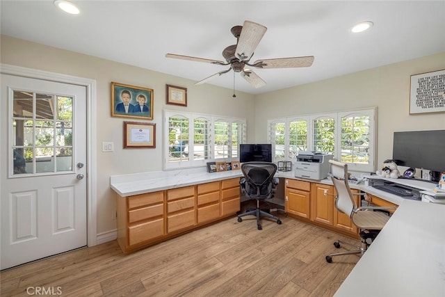 office space featuring ceiling fan and light hardwood / wood-style flooring