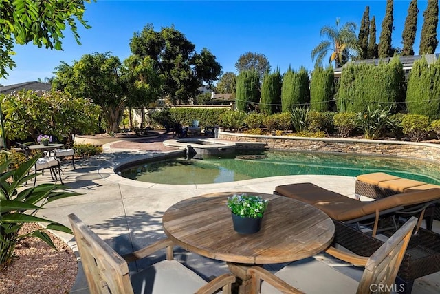 view of property's community featuring a patio area and a swimming pool