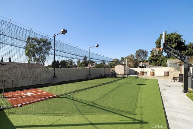 view of yard with basketball court