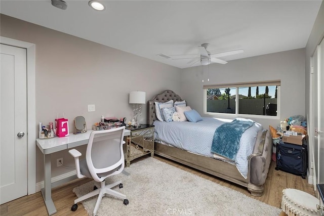 bedroom featuring ceiling fan and wood-type flooring