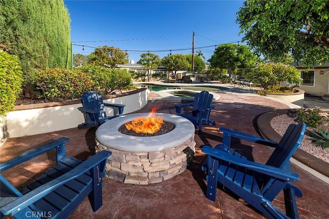 view of patio featuring a fire pit