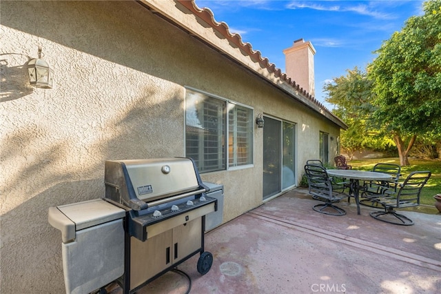 view of patio featuring a grill