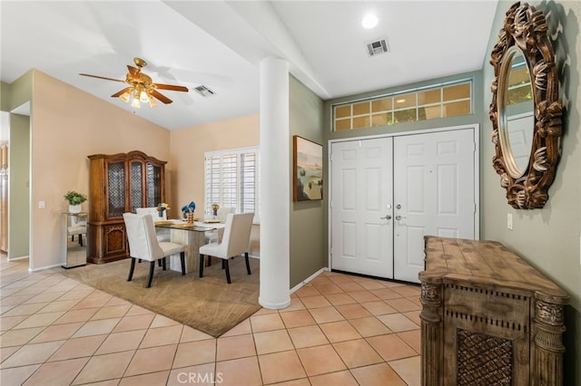 foyer entrance featuring ceiling fan and light tile patterned flooring