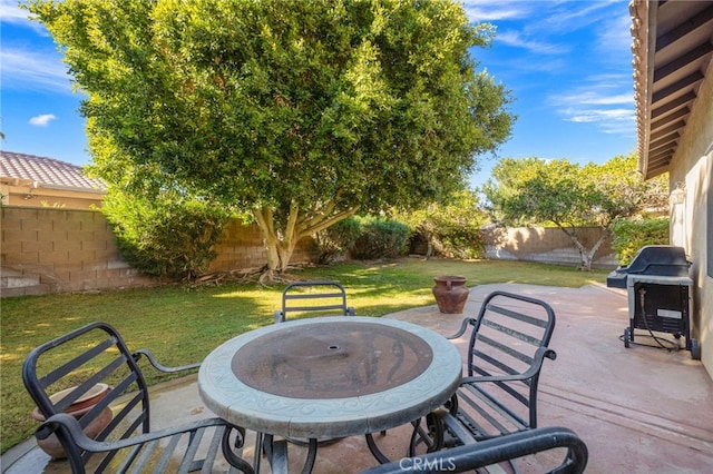 view of patio featuring a grill