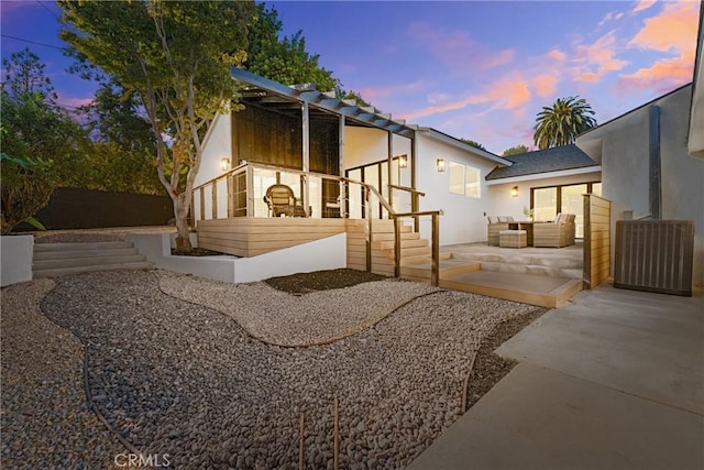 exterior space with outdoor lounge area and a patio